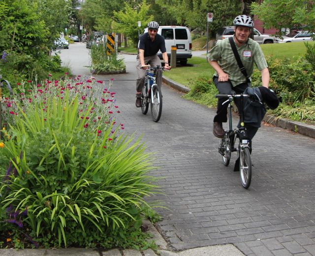 Two bicyclists enjoy a low-stress ride in Vancouver, BC