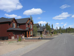 Newer 2-story homes with frontage on paved, rural road.