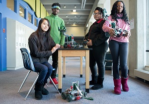 Students showing off their robotics class projects