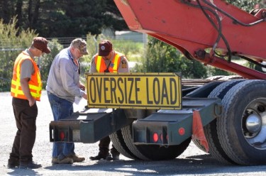 ODOT employees inspecting an oversize load truck