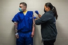 inmate receiving injection
