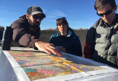 A photo of OWRD Staff reviewing a map