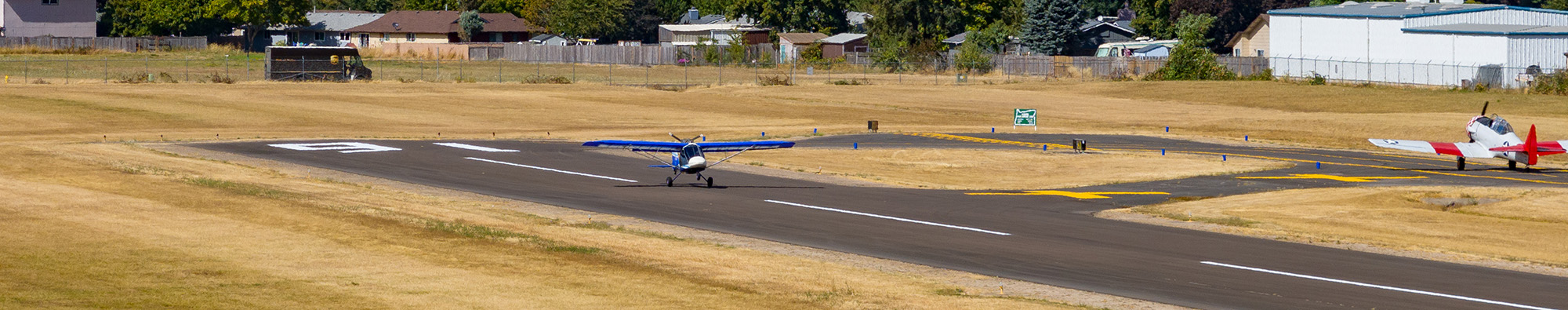 View of two planes on a runway
