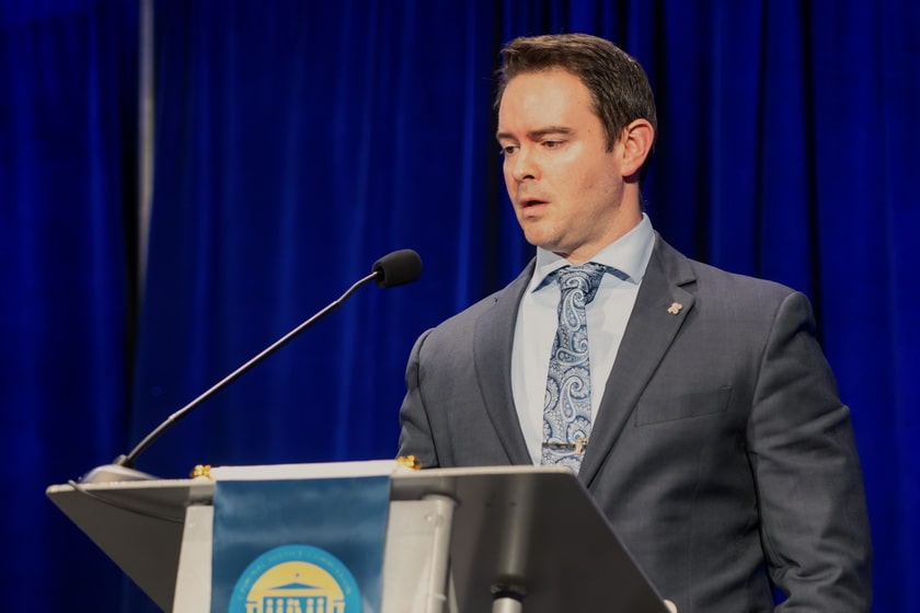 Chris Campbell addresses attendees and Joint Committee on Day 2 of the Summit