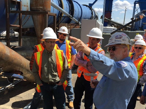 Staff members touring energy facility