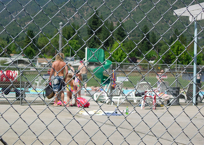People gather at a pool in Grants Pass