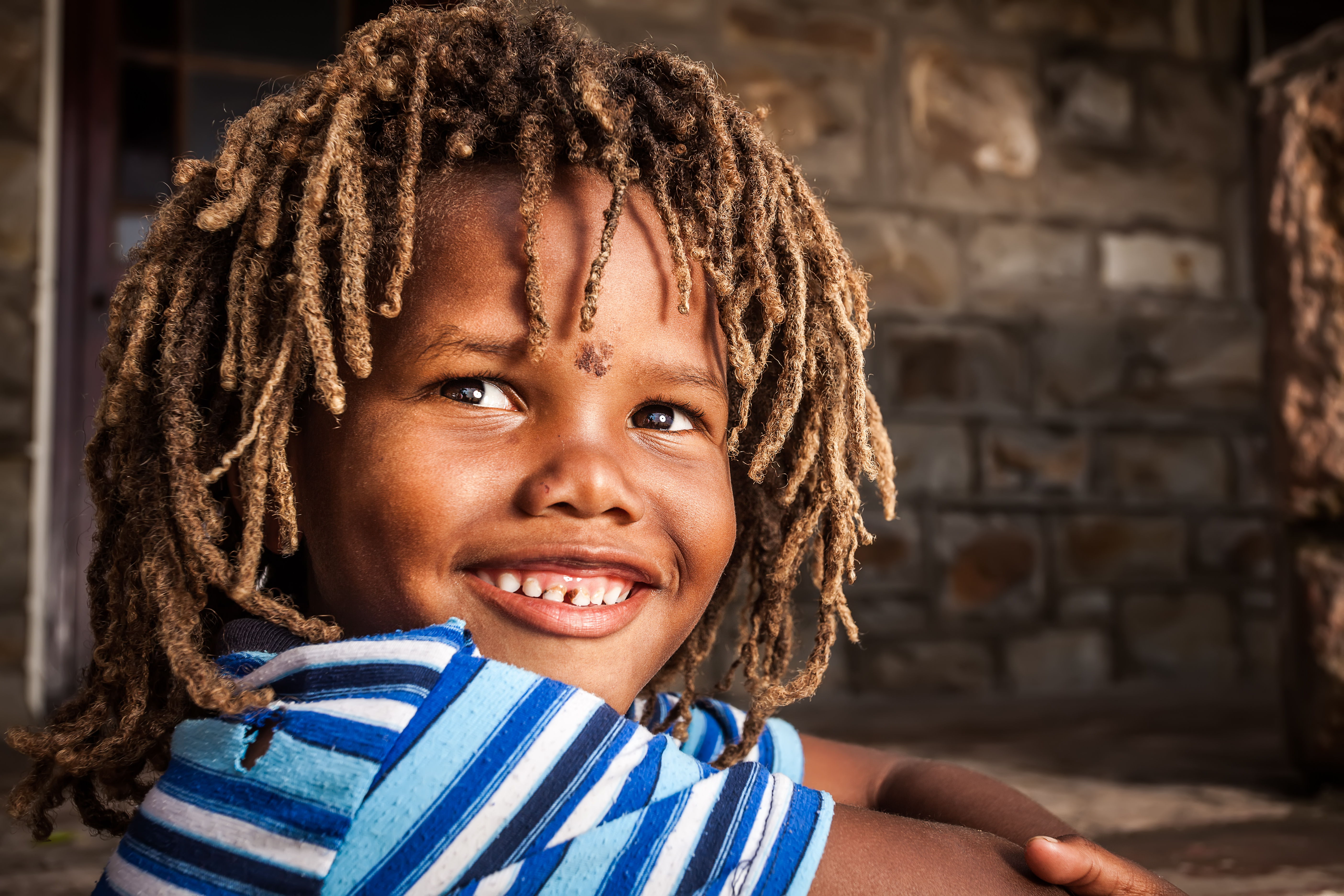 Young boy with locs