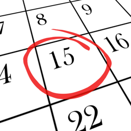 closeup of a monthly calendar with the number 15 circled in red