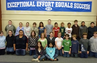 Exceptional Effort Equals Success Banner behind a Class of Students