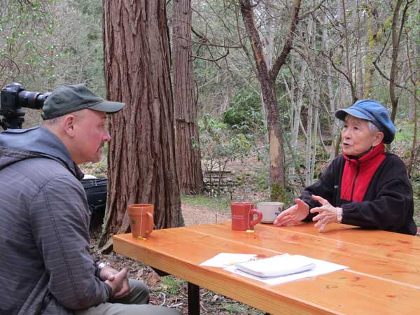 Japanese native Hideko Tamura-Snider explaining to ODF’s Jim Gersbach her wish for peace trees from Hiroshima.
