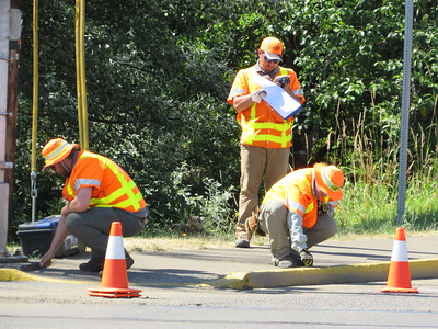 Image of ODOT workers inspecting a curb ramp during project planning