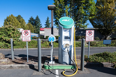 Image of a parking space with electric vehicle charger.