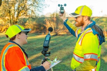Surveyors working with technology