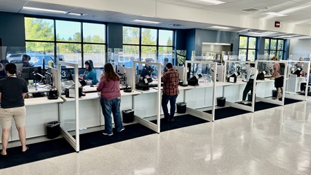 DMV personnel assist customers at the Eugene DMV office.