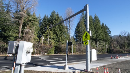 Infrastructure like this pedestrian crossing helps drivers better see people crossing the highway. November 2023.