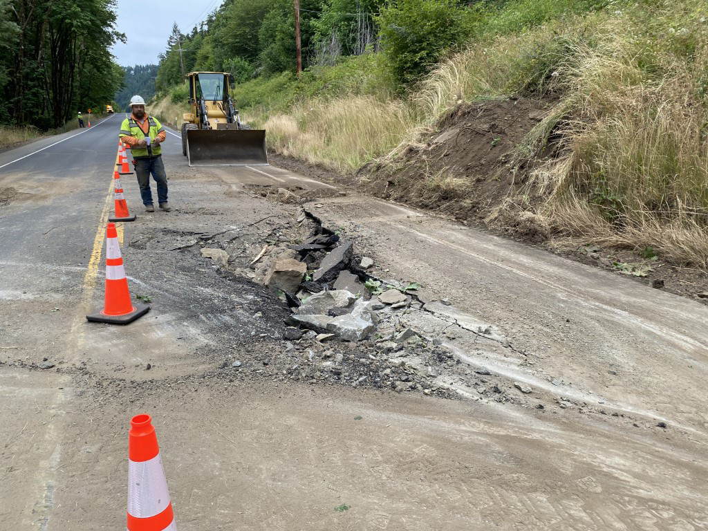 Roadway damage after rocks fell from the slope on the north side of Oregon 38.