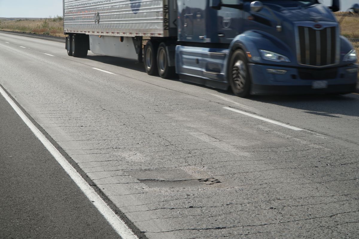 The combined impacts of heavy traffic and weather have created ruts and cracks in the pavement along this stretch of I-84.  