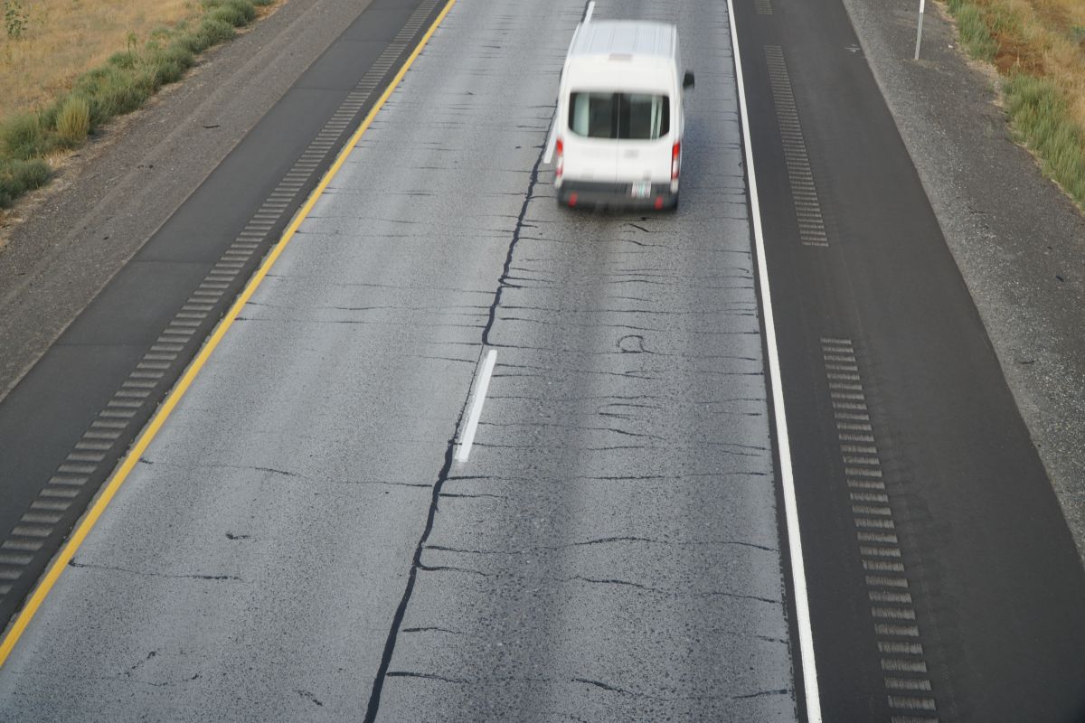 Prior preventive maintenance work, like crack seals and rut patches, are visible throughout the corridor. 