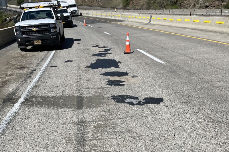 Pavement deterioration is visible along with past spot-repairs on these structures.