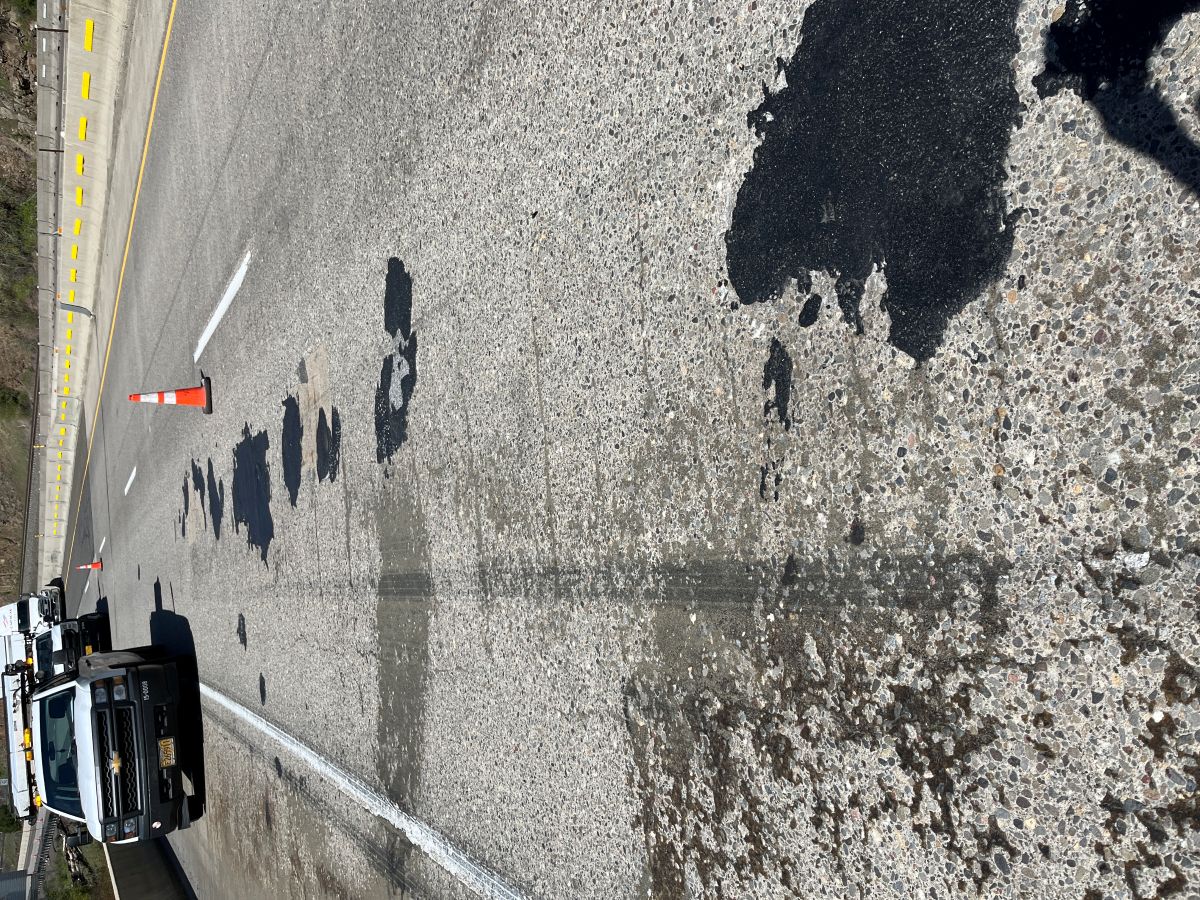 Pavement deterioration is visible along with past spot-repairs on these structures.