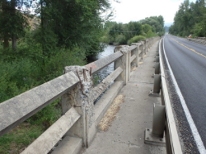 Exposed rebar on bridge rail