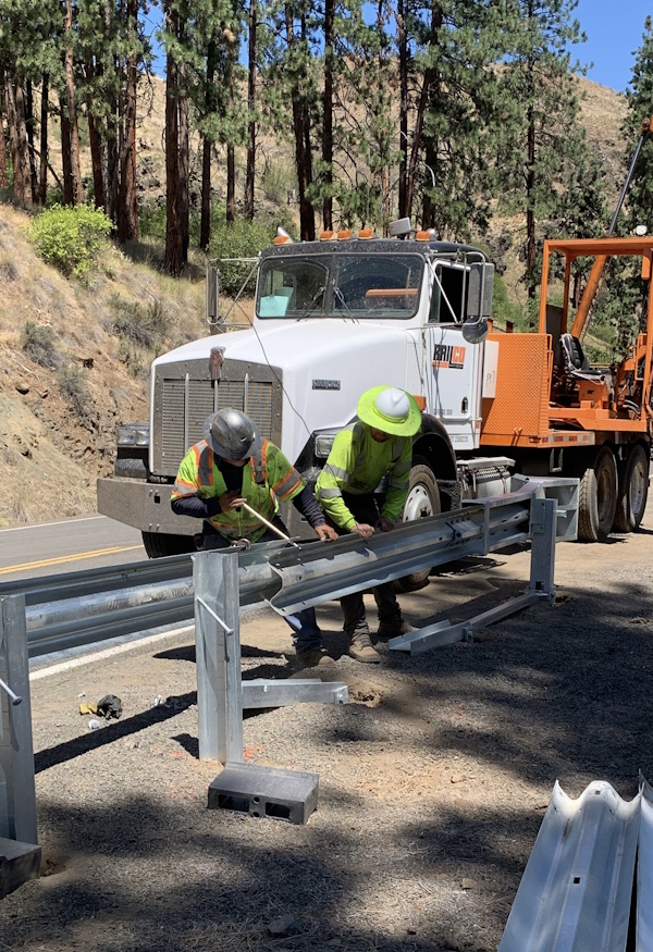 Crews install new guardrail on OR 86 east of Halfway.