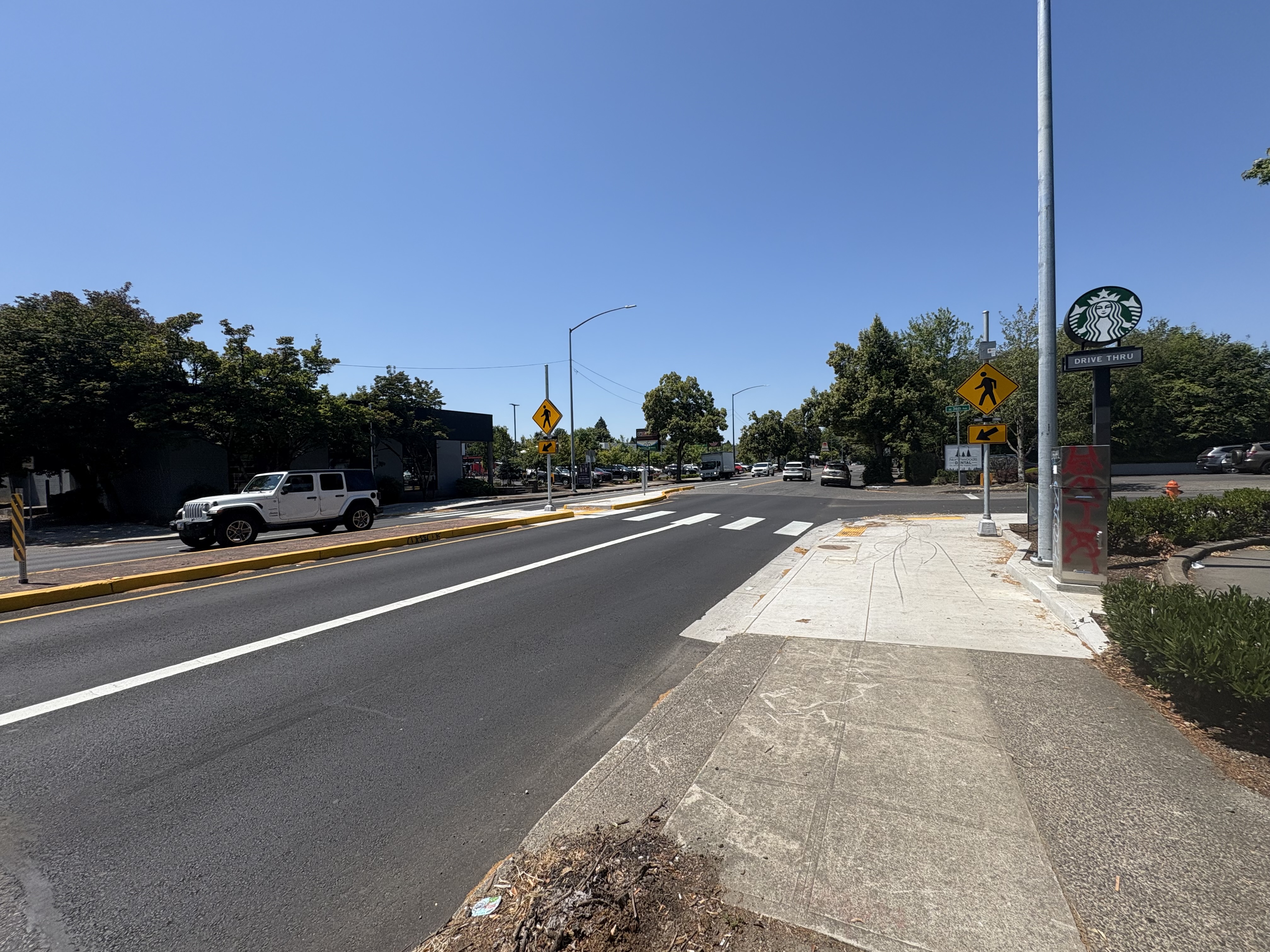 Example photo of an upgraded crosswalk with a Rectangular Rapid Flashing Beacon, or RRFB.