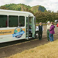 Woman and man talking outside before boarding the Columbia Gorge Express bus.