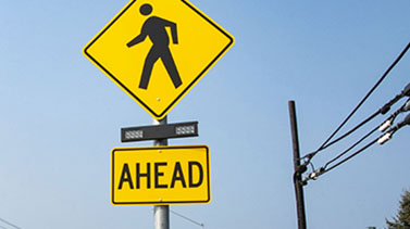 yellow pedestrians ahead signs
