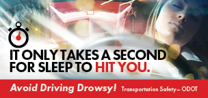 Drowsy Driving poster shows a woman falling asleep behind the wheel. Text reads, It Only Takes A Second For Sleep To Hit You.