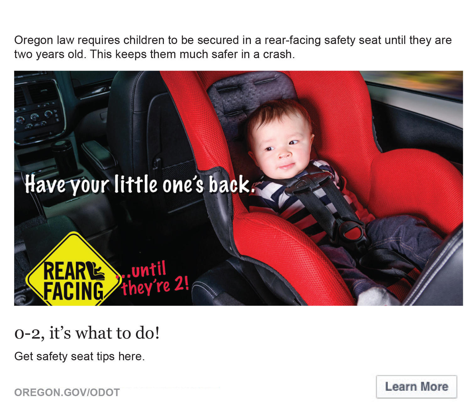 Image of a baby boy sitting in a rear facing car seat