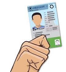 An animated hand holding an Oregon driver license