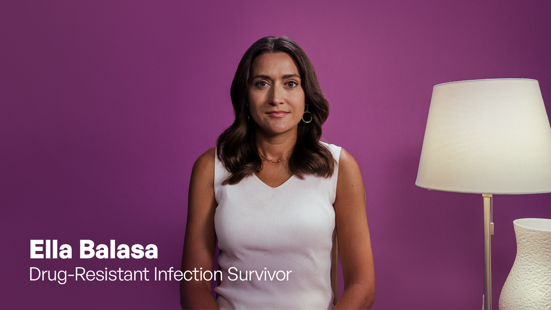 Woman in white shirt and purple room