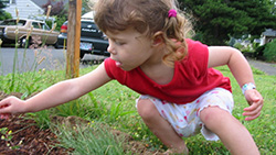 child playing in soil