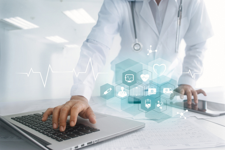 Technology, Health Care Provider Typing On Laptop, Icons Floating.jpg