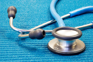 stethoscope resting on a blue background