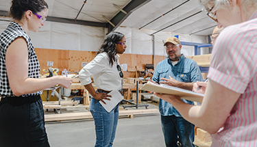 OHCS Director Andrea Bell onsite with developers