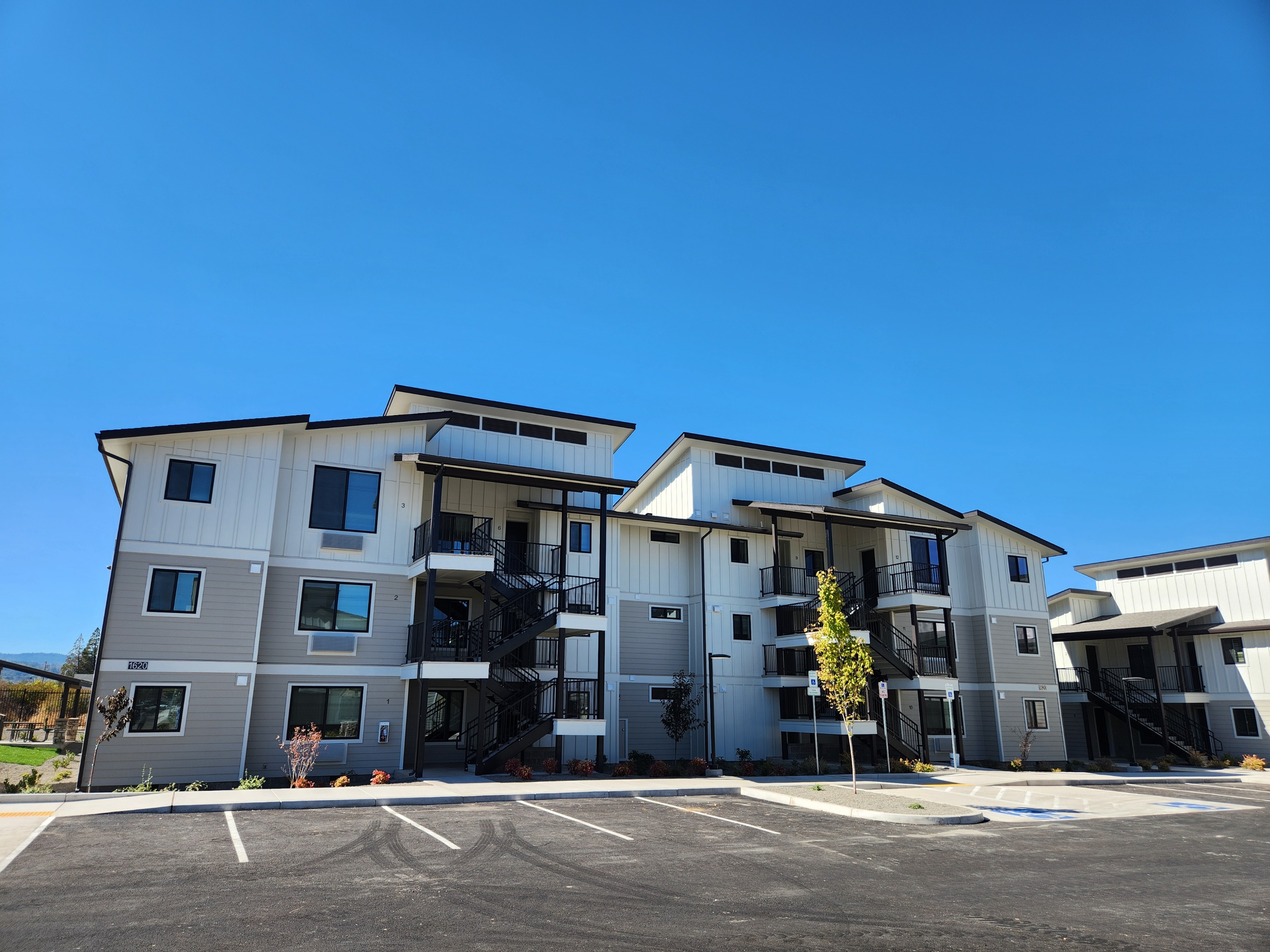 photo of the front of a multi-story apartment complex