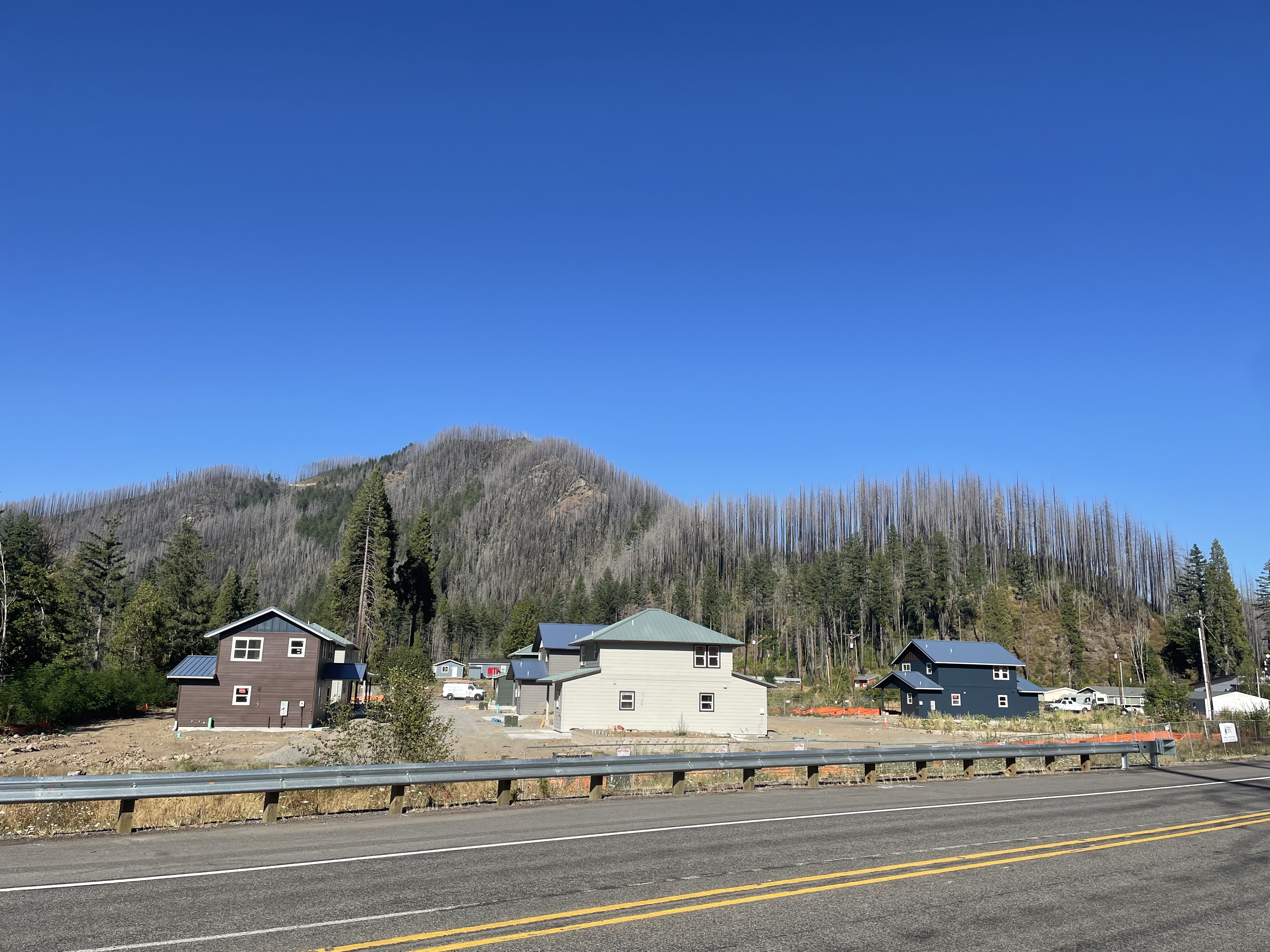 photo of the multiple single-family homes across a highway
