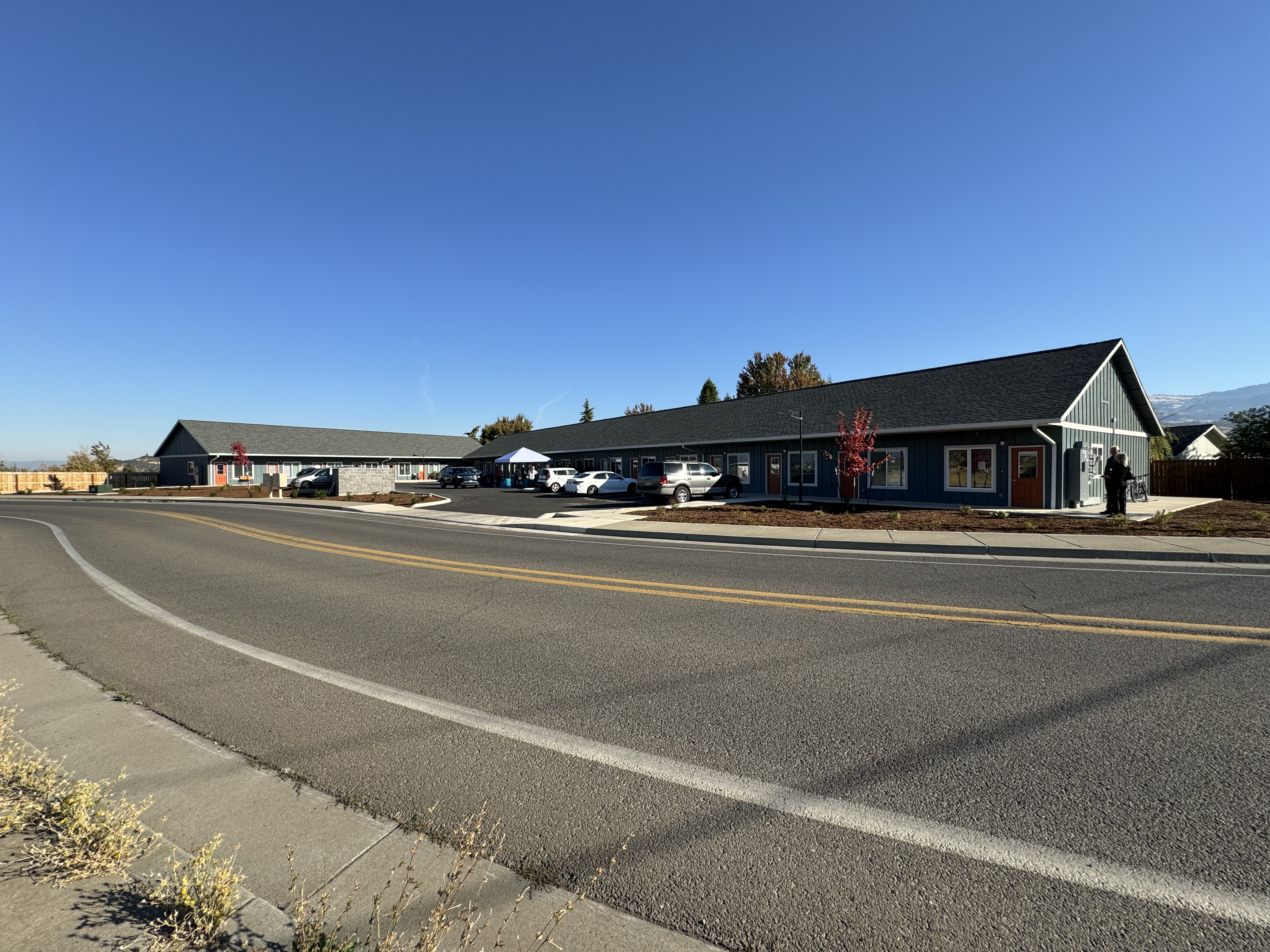 photo of the front of a single-story multi-unit housing complex