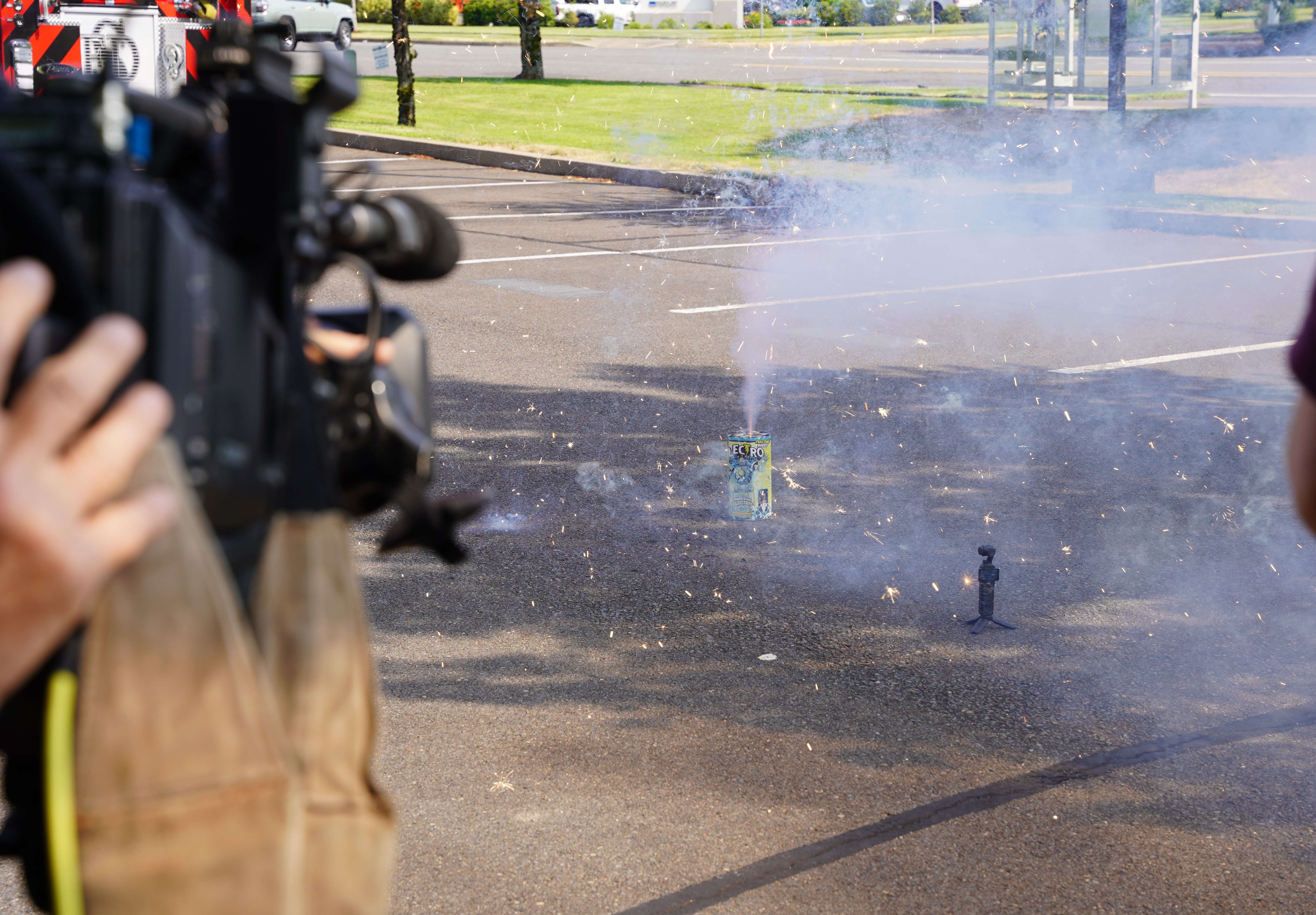 a lit firework on pavement