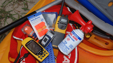 A whistle, horn, EPIRB, PLB, flotation devices, and other safety equipment