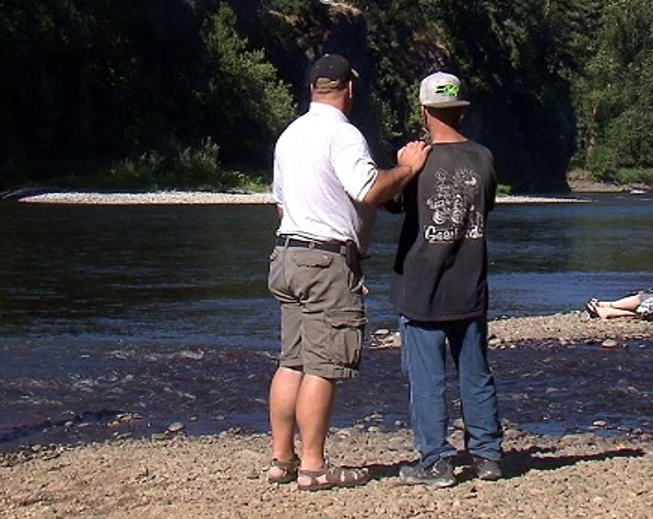 Rob O'Meara and Jack Eichhorn on the bank of the Clackamas River near the location where Meg's body was recovered in 2013.
