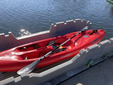 Red kayak in a nonmotorized launch for easier boarding