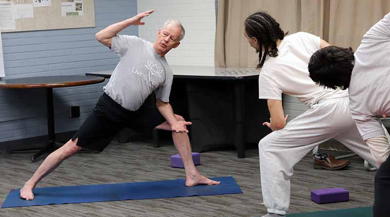 volunteer teaching yoga class