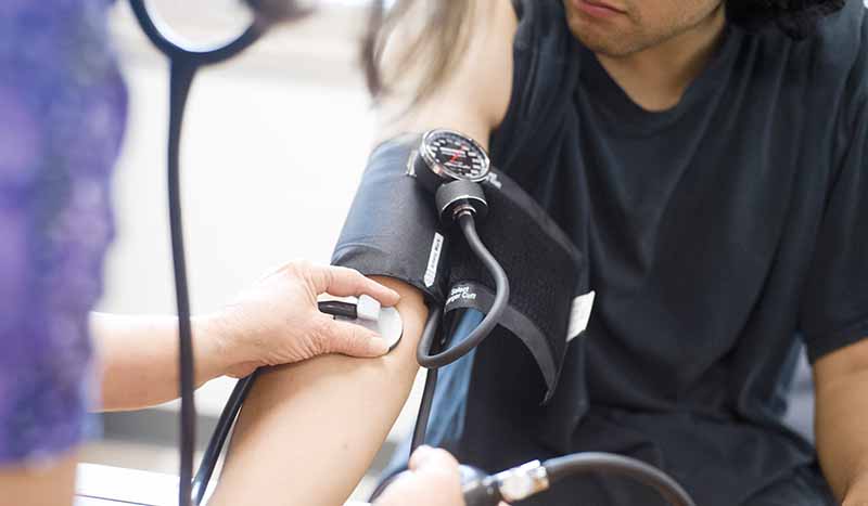 nurse taking blood pressure