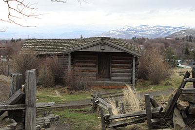 cabin with snowy mountains in background.jpg
