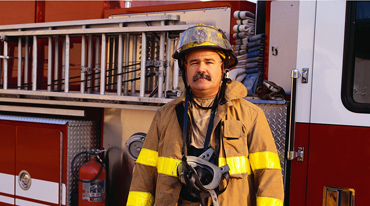 Fireman-Stand-in-Front-of-a-Fire-Truck