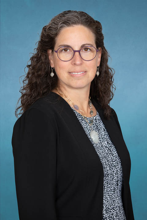 Commissioner Letha Tawney smiling