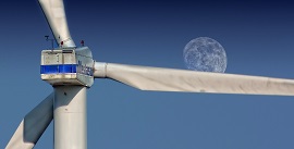 wind turbine with moon in the background
